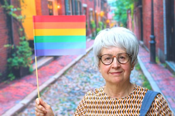 Woman holding Pride flag